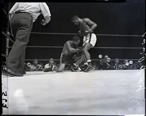 Archie Moore Falls Under Floyd Patterson