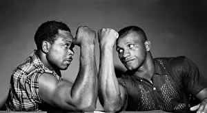 Rivalry Prints: Archie Moore and Harold Johnson Comparing Arms