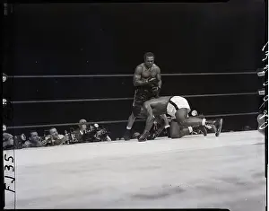 Archie Moore Standing Over Patterson