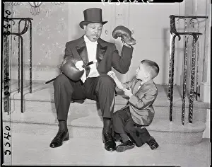 Archie Moore In Tux and Boxing Gloves