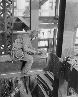 Prints of (Original Caption). New York: One Of New York's Unsung Heroes. There are men who take their lives in their hands every time they go to work, and they do work regardless of weather conditions Daredevil Construction Worker Prints: Architectural Worker Atop Skyscraper