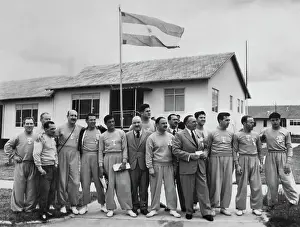 Prints of Members of the Argentine Olympic team stand in front of their country's flag at the Olympic village in Melbourne, Australia, November 18th 1956. (Photo by UPI/Bettmann Archive/Getty Images) Bettmann Archive Prints: Argentine Olympic Team In Melbourne
