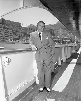 Monaco Prints: Aristotle Onassis Leaning on Railing of His Yacht