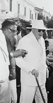 Aristotle Walking With Winston Churchill and Using Cane