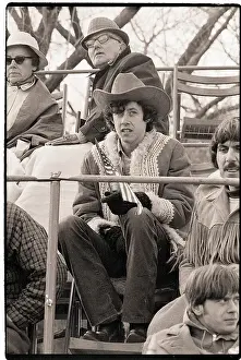 Arlo Guthrie Seated Holding Flag