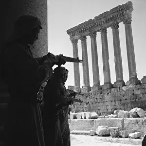 Hiding Prints: Armed Rebels Take Cover in Ruins