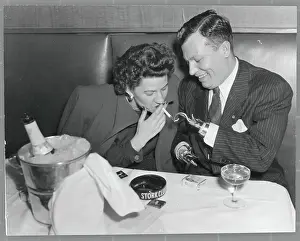 Russell Prints: Armless Man Lighting Cigarette