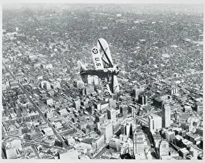 Detroit Prints: Army Airplane Flying Above City