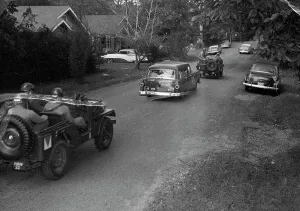Jeep Prints: Army Jeeps Escort Station Wagon with African American Students