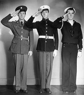 Army, Marine & Navy men in uniform saluting