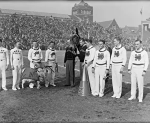 Goat Prints: Army and Navy Cheerleaders Posing with Mascots