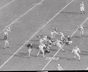 Army and Navy Football Players Competing in a Game