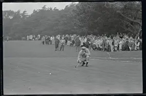 Prints of (Original Caption). Arnold Palmer studies the lay of his ball, as his famed Arnie's Army, watched in the background, on the 2nd green and the third round of the Lucky International Tournament Par for the Ages: Capturing the Triumphs and Tributes of Golf's Beloved 'King': Arnold Palmer Bending Down on Golf Course