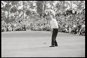 Arnold Palmer in Position to Putt Golf Ball