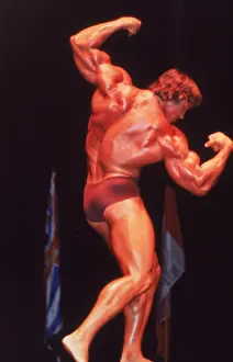 Arnold Schwarzenegger Flexing Muscles