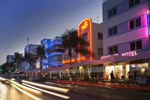 Incidental People Collection: Art Deco hotels on Ocean Drive at dusk
