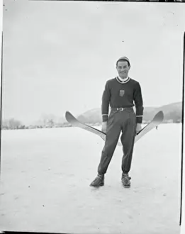 Art Devlin Holding a Pair of Skis