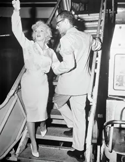 Passenger Airplane Prints: Arthur Miller and Marilyn Monroe Boarding Plane