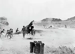 An Artillery Unit Firing Their Weapon