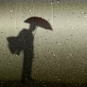 Images Dated 28th June 2015: Artistic silhouette person with umbrella