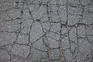 Damage Gallery: Asphalt cracked by frost and cold, potholes in Berlin, Germany, Europe