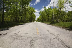 Images Dated 30th May 2011: Asphalt road with pothole in the countryside, Quebec, Canada