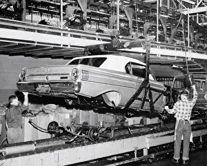 Assembly Line Prints: Assembly Line Men Lowering Down Car
