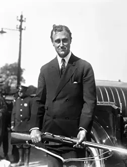 Franklin D Prints: Assistant Secretary of the Navy Franklin D. Roosevelt Standing with Rifle