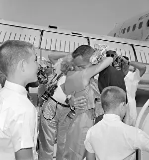 Astronaut Scott Carpenter Embracing His Wife with Sons Nearby