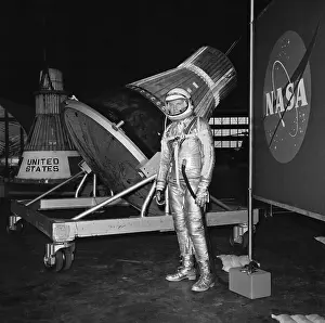 Astronaut Prints: Astronaut In Space Suit In Front Of Caps