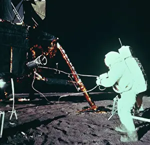 Astronaut Working with Equipment on Moon Surface