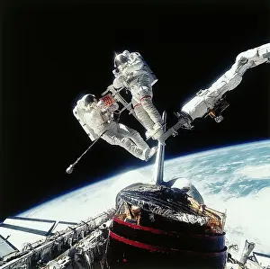 Cosmic Chronicle Prints: Astronauts Holding For Sale Sign in Space