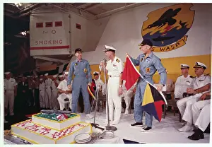 Astronauts James Lovell and Buzz Aldrin Receiving Cake