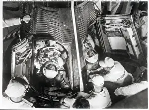 Orbiting Prints: Astronauts Lie on Backs in Space Capsule