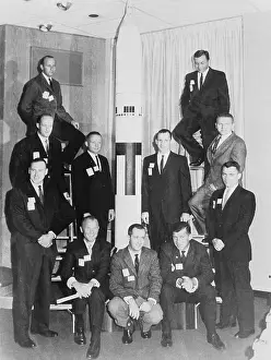 Astronauts Posing Near Model