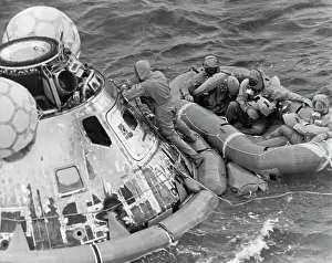 Apollo Prints: Astronauts in Quarantine Suits on Raft