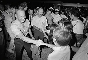 Astronauts Shaking Hands with Employees