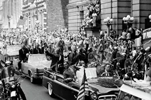 Astronauts Wave from Parade Automobile