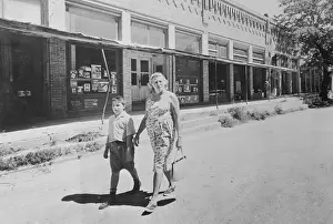 Atheist Walking Down Street with Her Son