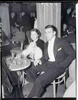 Athlete and Actor Buster Crabbe Sitting With His Wife in Club