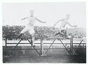 Prints of (Original Caption). Olympic Games, London, England 1908. 400 meters hurdles, the 3rd hurdle, left to right: Harry Hillmand, U.S.A. 2nd and Charles Bacon, U.S.A 1st Capturing Glory: A Journey Through Olympic History: Athletes Jumping Hurdles