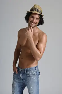Merry Prints: Athletic man, early 30s, bare-chested wearing jeans and a hat