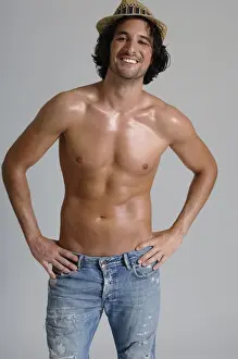 Studio Prints: Athletic man, early 30s, bare-chested wearing jeans and a hat