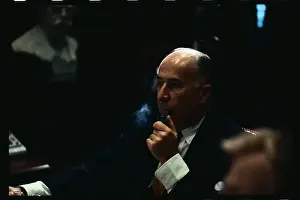 Attorney General John Mitchell Smoking a Pipe