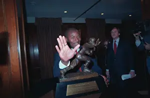 Auburn Football Player Bo Jackson Gesturing with the Heisman Trophy