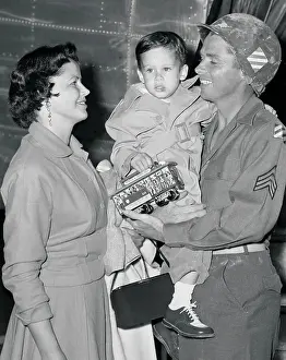 Audie Murphy Holding His Son