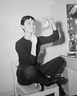 Side Chair Prints: Audrey Hepburn with Fingers Crossed Holding an Angel