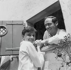 Prints of Portrait of actors and spouses Audrey Hepburn and Mel Ferrer holding hands through an open window, January 7th 1957. (Photo by Pictorial Parade/Archive Photos/Getty Images) Elegance Personified – A Classic Art Print Collection: Audrey Hepburn And Mel Ferrer