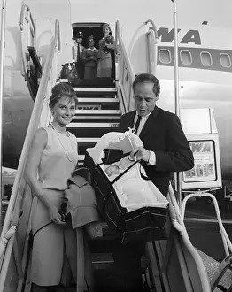 Gangway Prints: Audrey Hepburn and Mel Ferrer Walking From Airplane With Their Baby