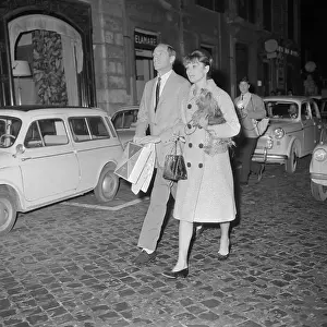 Audrey Hepburn and Mel Ferrer Walking Across Mall